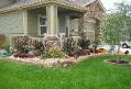 fron yard rennovation with strip stone wall and perennials